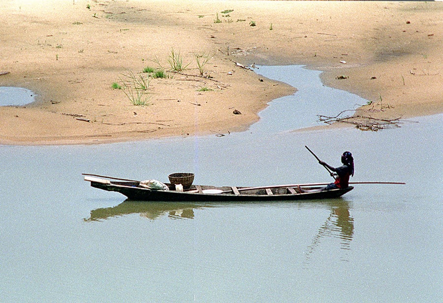 The Niger River with islands visible when the river is not flooding.  The Niger River with islands and fishermen.