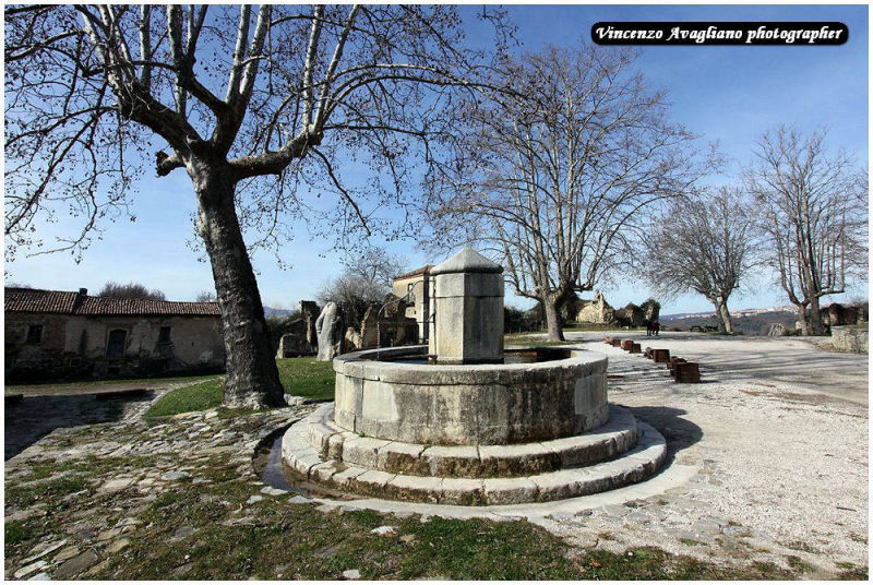 Circular stone fountain in Piazza Nicotera Roscigno Vecchia.