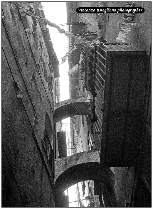 Salerno historic center - Alley with arches and laundry hung out to dry.
